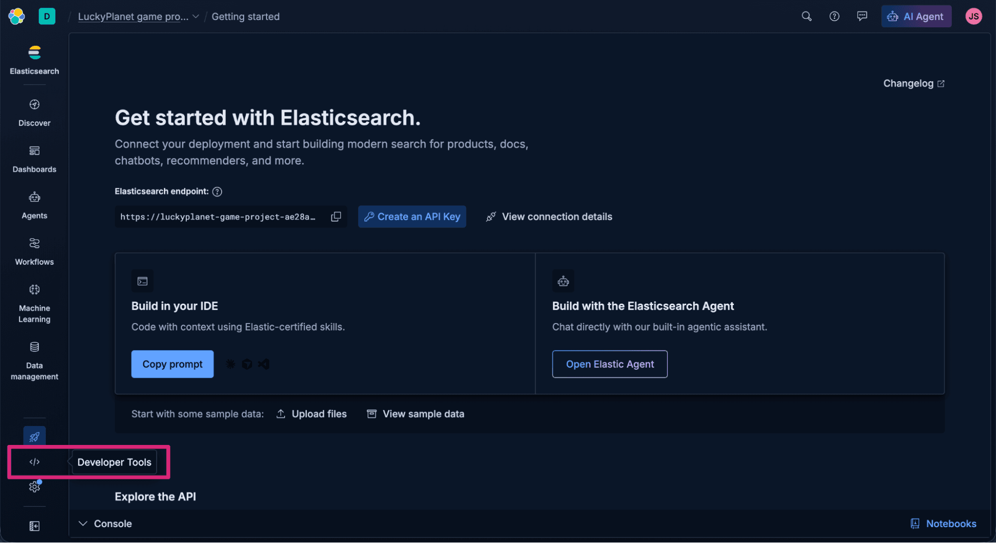 Screenshot of the “Getting started” page in Elasticsearch, showing connection setup options for deployments and API keys. The interface includes panels for building in an IDE or with the Elasticsearch Agent, sample data upload buttons, and a dark sidebar with navigation items. The focus is on "Developer Tools."
